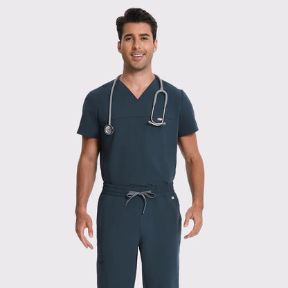 KungFu Scrubs dark harbor men's scrub set with V-neck top and jogger pants, shown on male healthcare model