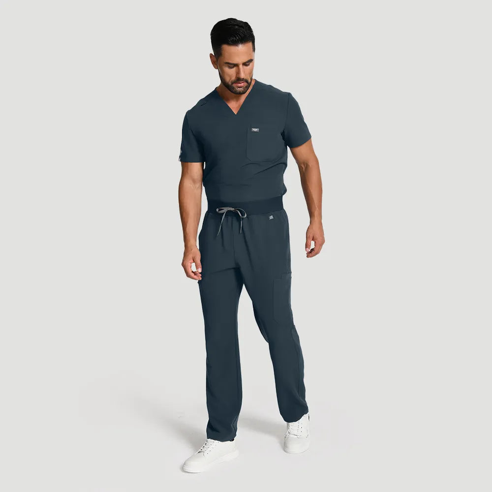 Dark Harbor men’s scrub set, angled view showing full outfit and functional pockets.