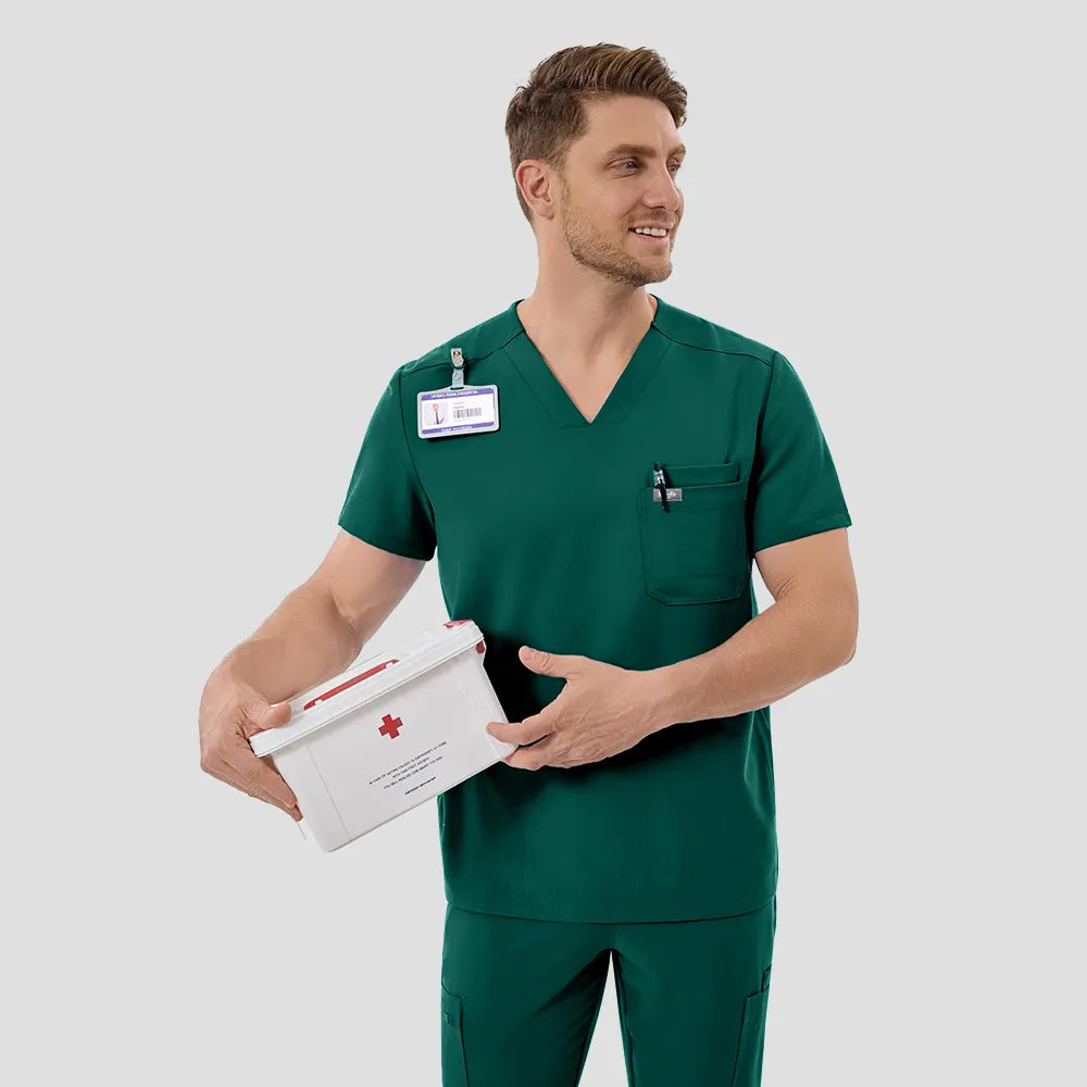 KungFu Scrubs men’s hunter green scrub top in use with medical supply box
