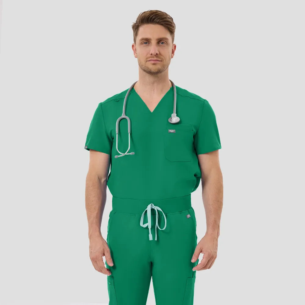 Male model wearing Indocyanine Green V-Neck Scrub Top and Jogger Pants, front view, white background.