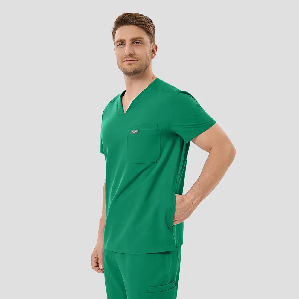 Male model angled front, hands in pockets, Indocyanine Green scrubs.