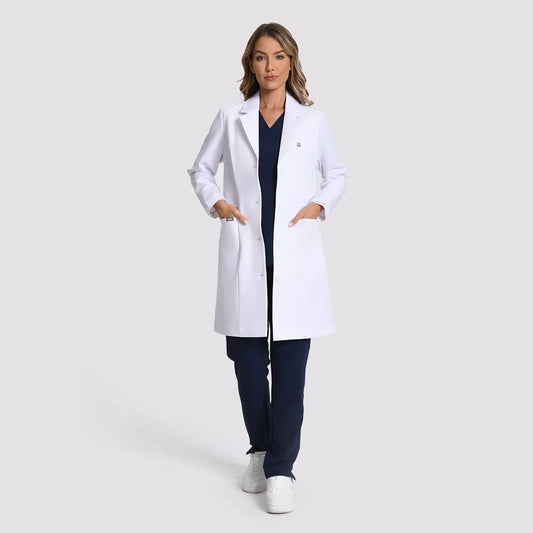 KungFu Scrubs women’s long white lab coat full front view over navy scrubs